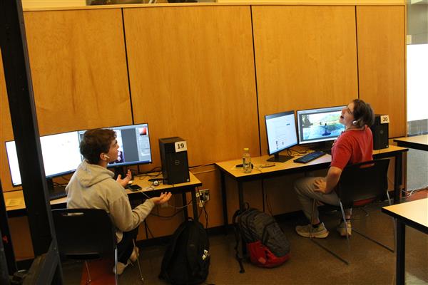 Students discuss their projects in Graphic Arts class